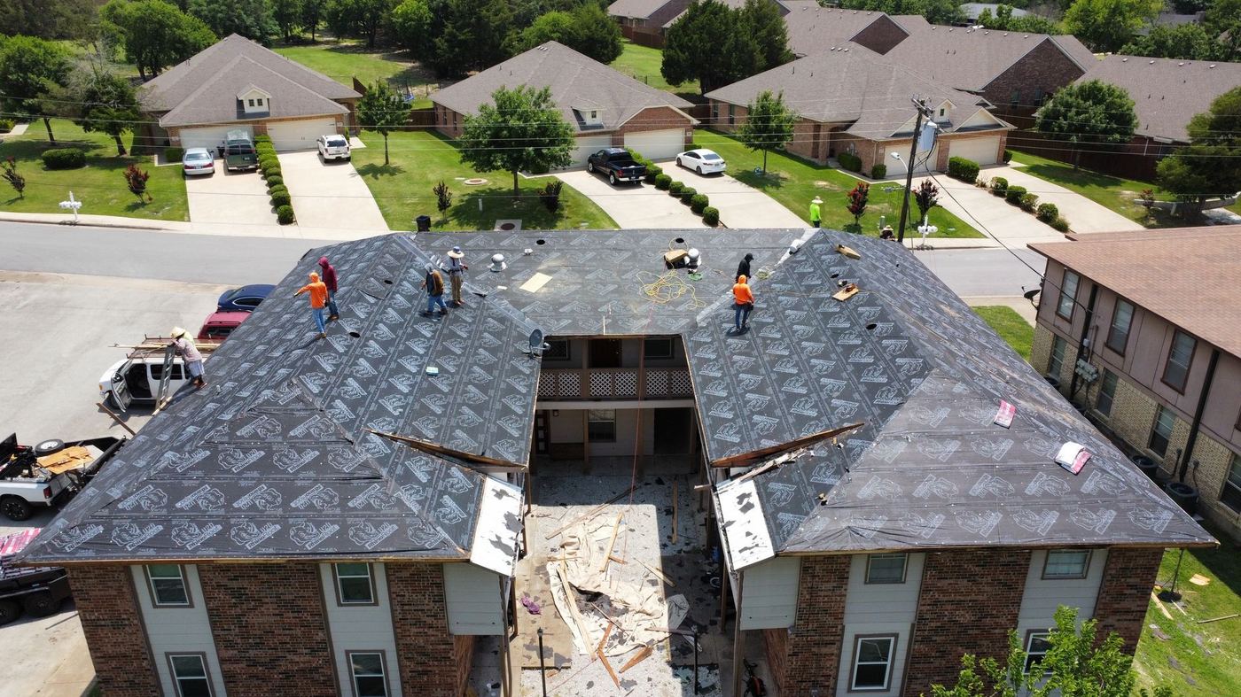Aerial of a neighborhood roofing project